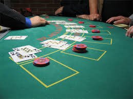Mobile phone screens showing flyingslot login live casino games and sportsbook interface